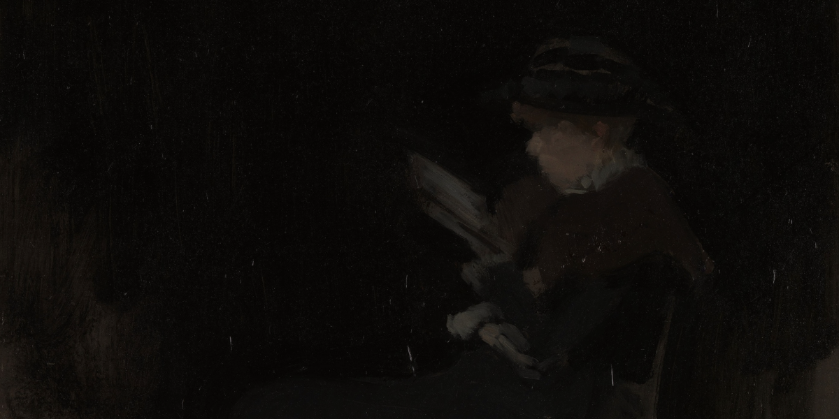 Portrait of woman with fur stole sitting and reading against black background